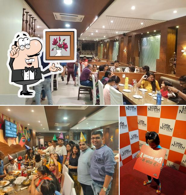 Take a seat at one of the tables at Little North Fine Dining (Veg Only)