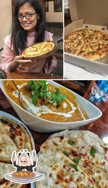 Order pizza at THE ROOTS CAFE AND RESTAURANT