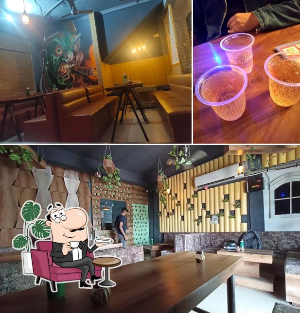 Check out the picture displaying interior and beer at Pizzeria Hut