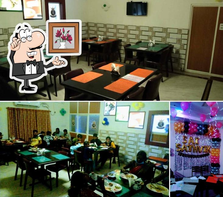 Take a seat at one of the tables at RR Ruchi Restaurant