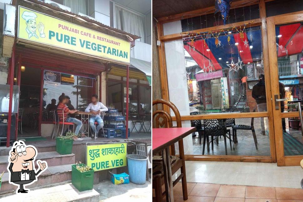 Take a seat at one of the tables at Punjabi Cafe & Restaurant