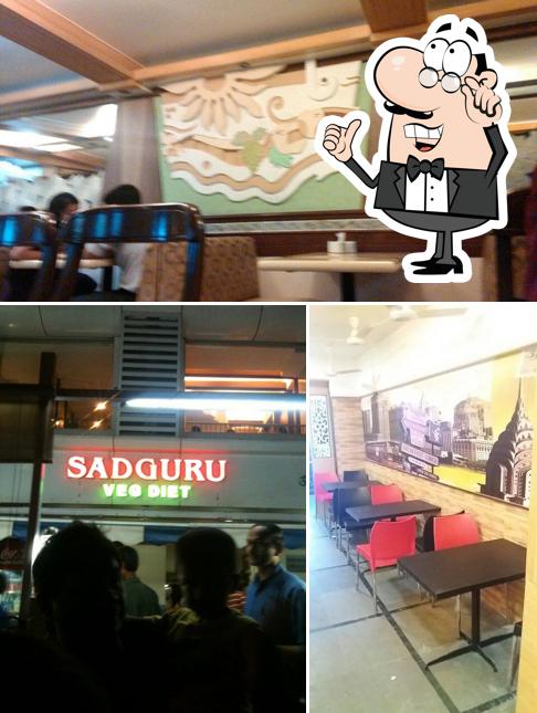 Take a seat at one of the tables at Hotel Sadguru