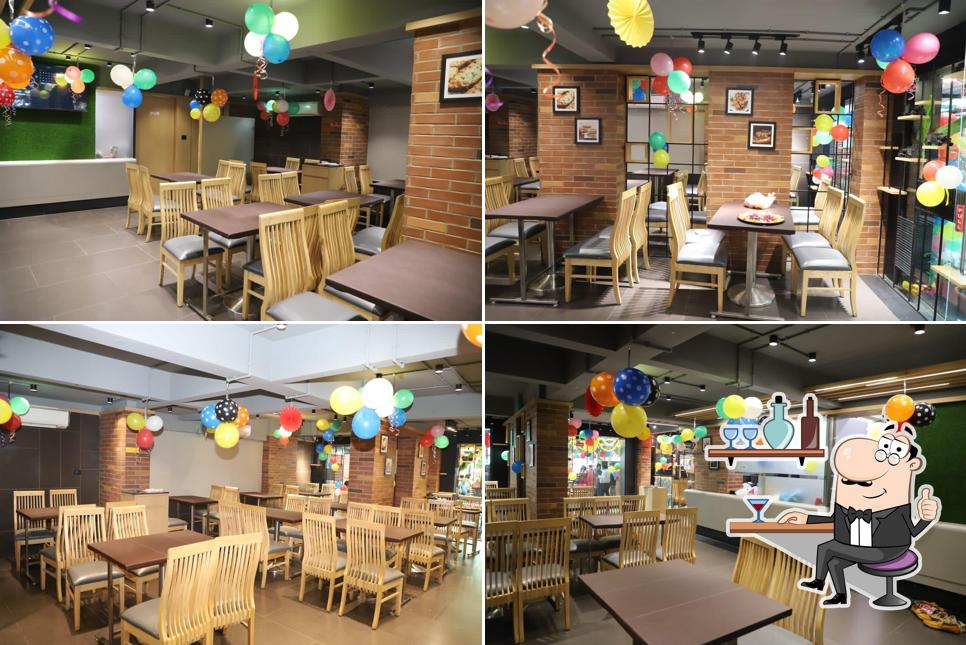 Take a seat at one of the tables at Lemon Zest Restaurant