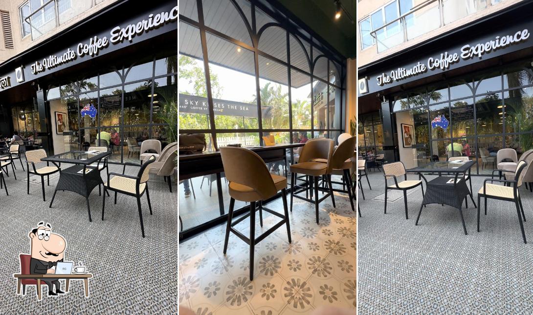 Take a seat at one of the tables at Coffee By Di Bella Belapur