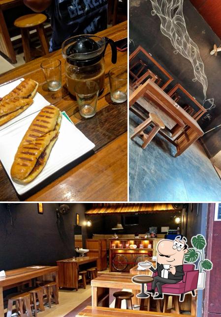 Among different things one can find interior and dining table at Teapot Café