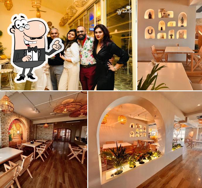 Take a seat at one of the tables at The Off White Bar & Grill