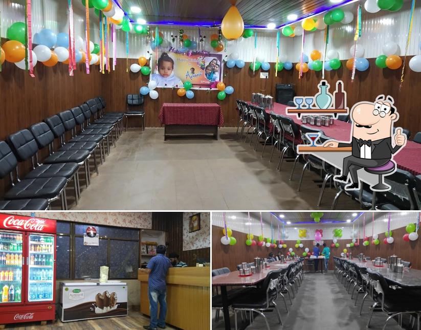 Take a seat at one of the tables at Punjabi Tadka A/C Family Restaurant