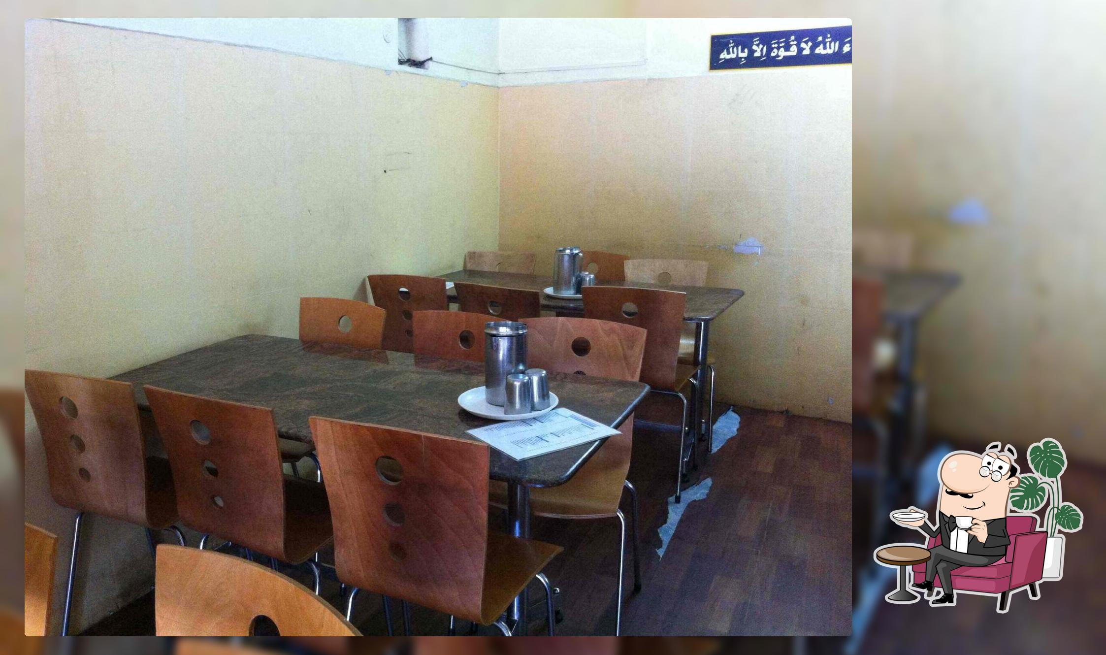 Take a seat at one of the tables at Salwa Restaurant