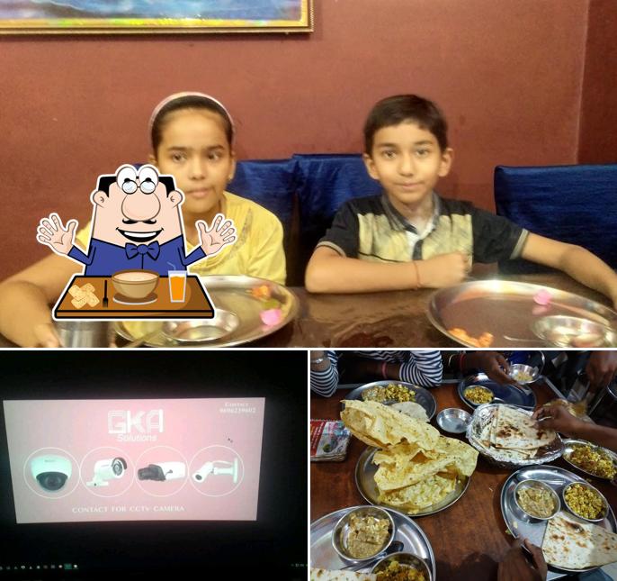 Among different things one can find food and interior at New Sahu Dhaba & Family Restaurant