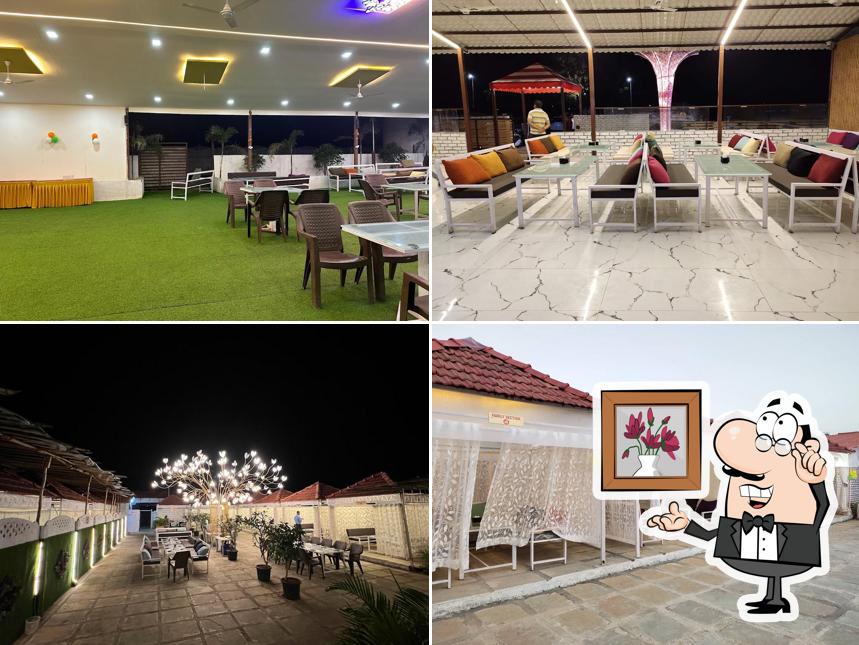 Take a seat at one of the tables at Hotel Shree Nashik Darbar