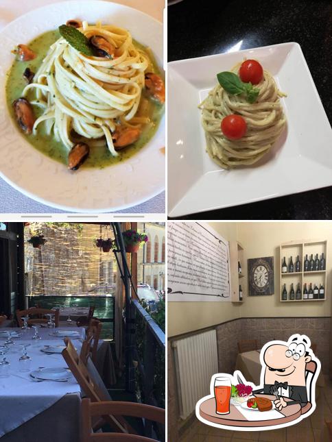 Questa è la foto che presenta la tavolo da pranzo e cibo di Il Mito di Kore