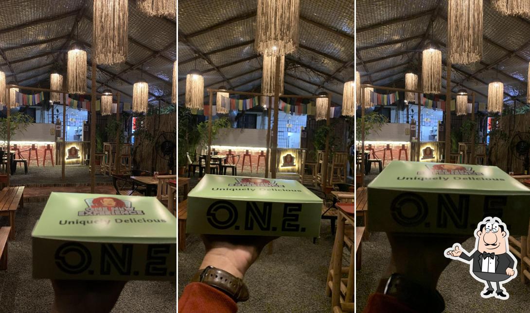 Take a seat at one of the tables at One New Experience