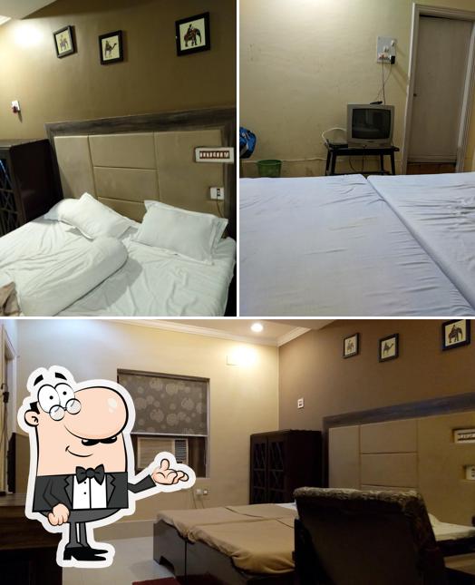 Take a seat at one of the tables at Hotel Ashoka