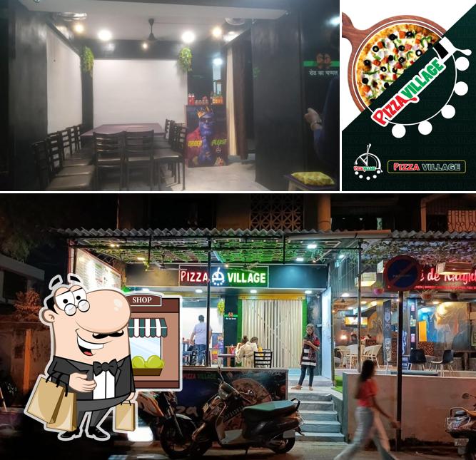 Pizza Village is distinguished by exterior and interior