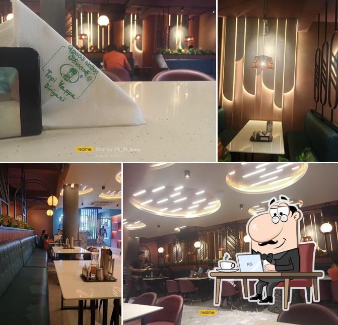 Take a seat at one of the tables at TOPI VAPPA BIRIYANI DHARMAPURI