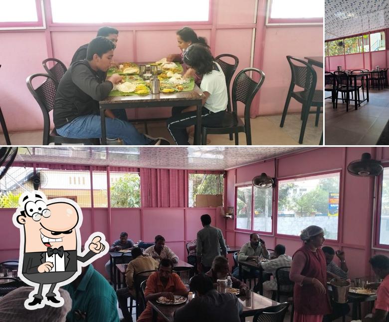 Take a seat at one of the tables at Pournami janakeeya hotel