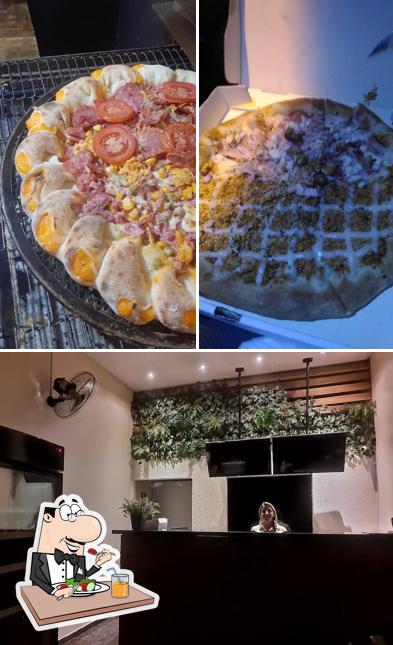 Esta é a ilustração ilustrando comida e interior a Real Pizzaria e Esfirraria