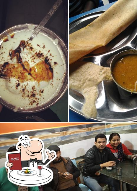 Take a look at the photo showing food and interior at Swad Griha