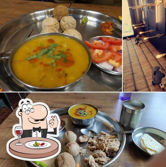 This is the image displaying food and interior at Mahakali Dal Bati surat