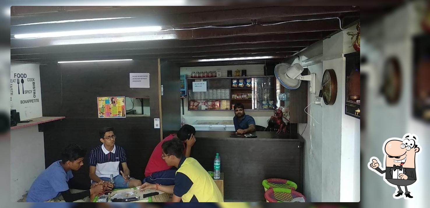 Take a seat at one of the tables at V.D.N Cafe