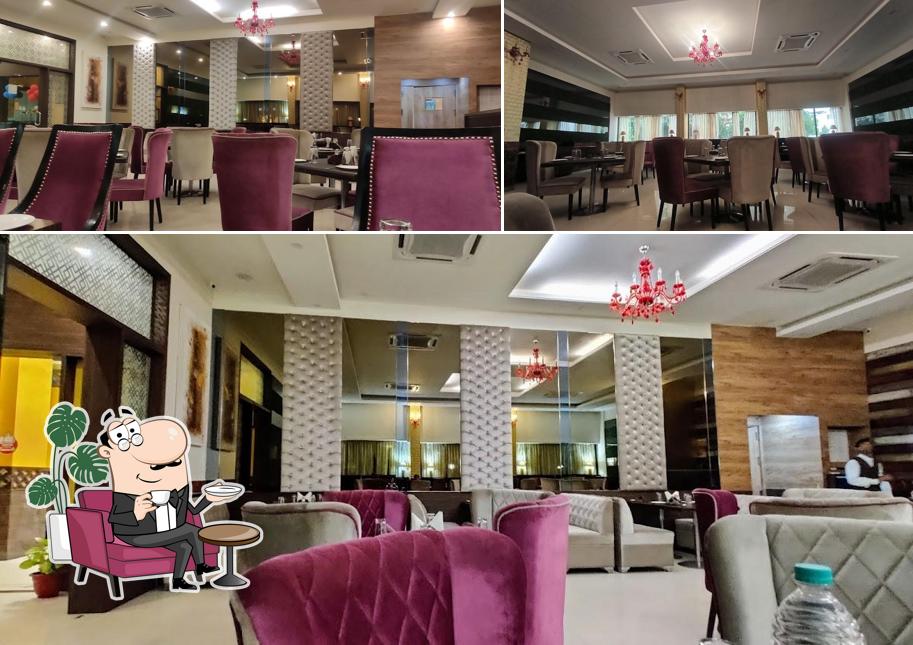 Take a seat at one of the tables at ਮੋਤੀ ਮਹਲ ਡੀਲਕਸ