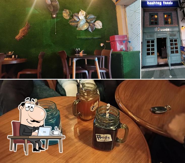 Take a seat at one of the tables at Hashtag Foods