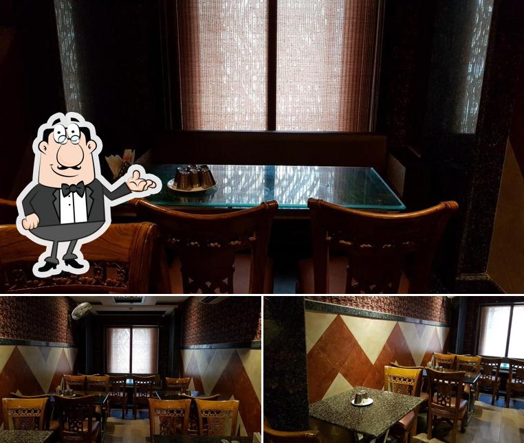 Take a seat at one of the tables at Hotel Swadist