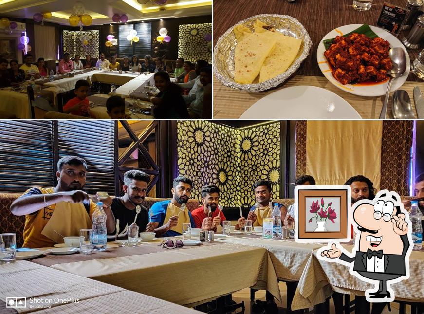 Take a seat at one of the tables at PALLKHI RESTAURANT