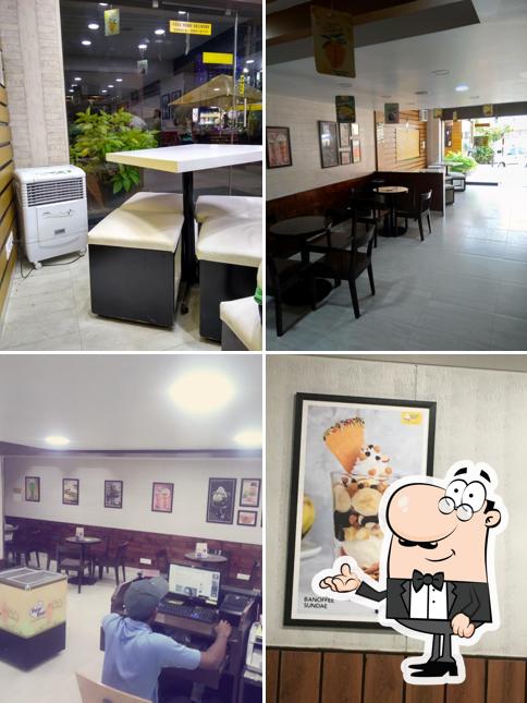 Take a seat at one of the tables at Polar Bear Ice Cream Sundaes - Fairlands