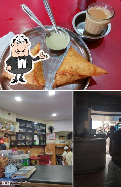 Check out the picture displaying interior and beverage at Madgaum Café