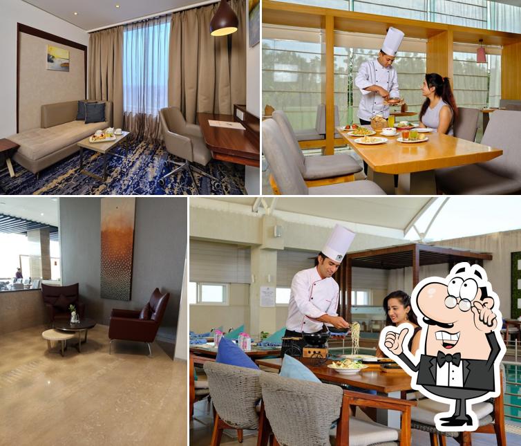 Take a seat at one of the tables at Sayaji Hotel Vadodara