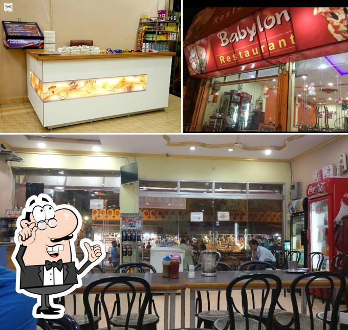 Take a seat at one of the tables at Babylon Restaurant