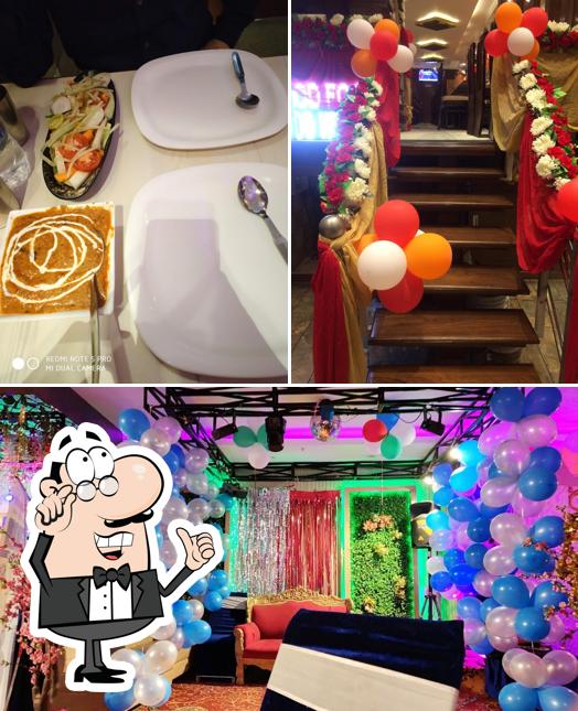 Take a seat at one of the tables at Manmatia Kitchen Hotel & Restaurant