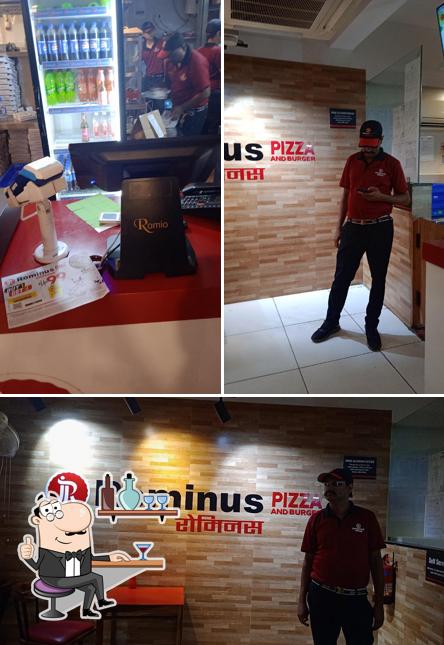 Take a seat at one of the tables at Rominus Pizza and Burger