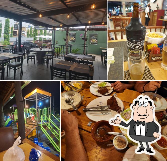 Sente em uma das mesas no OLIVA RESTAURANTE - À LA CARTE & PARRILLA