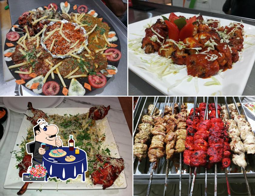 Order seafood at Mezbaan Pizza & Grill The Multi Cuisine Family Restaurant