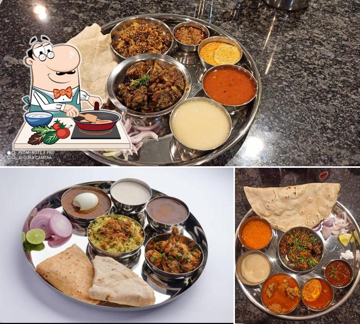 Chicken curry at HOTEL HERAMBH DINING