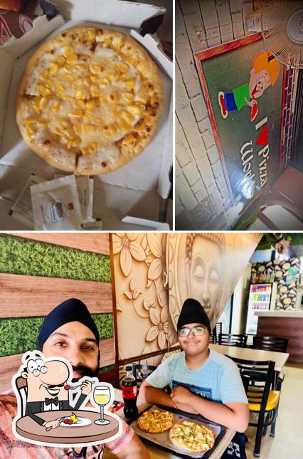 Check out the picture showing food and interior at Pizza World