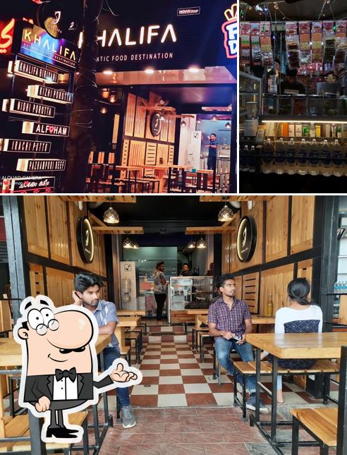 Take a seat at one of the tables at Khalifa Authentic Food Destination