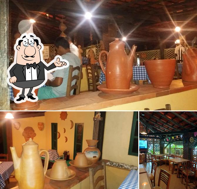 Sente em uma das mesas no Trattoria Il Maneggio