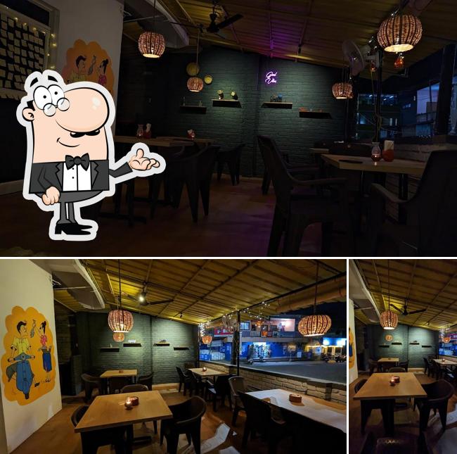 Take a seat at one of the tables at The Goan Belly