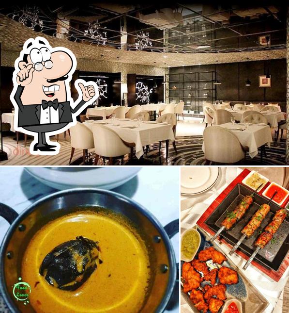 Take a seat at one of the tables at The Lounge - 24 hr Lounge / Bar in Gurgaon