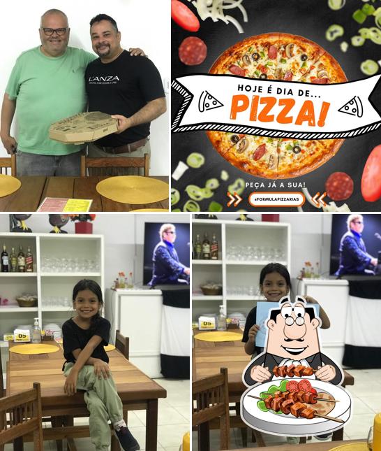 Entre diversos coisas, comida e interior podem ser encontrados no Pizzaria Fórmula 1