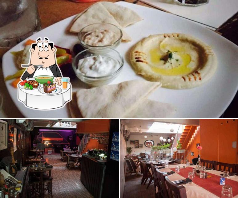 Check out the photo showing dining table and food at TLR Cafe