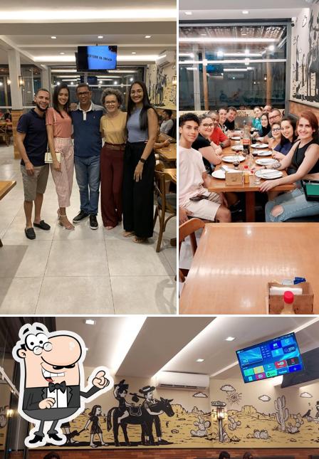 O interior do Ôxe Pizza Bar