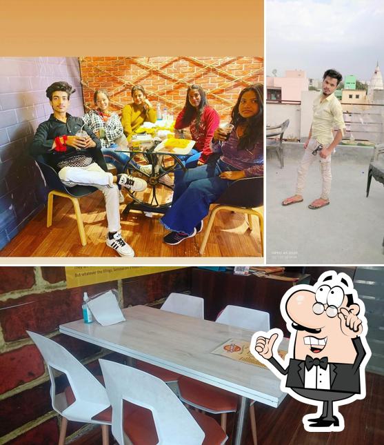 Take a seat at one of the tables at Samosa junction jammu