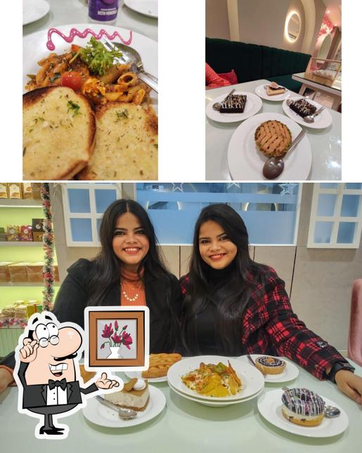 Take a seat at one of the tables at Olive Tree