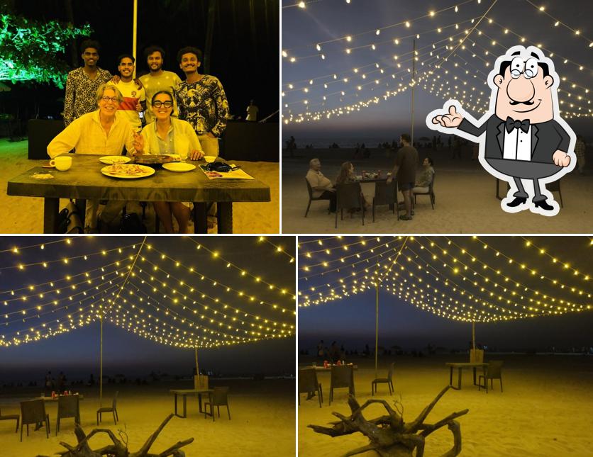 Take a seat at one of the tables at Louvre beach restaurant