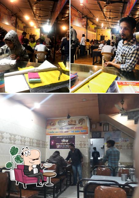 Take a seat at one of the tables at Jain Bhojanalay