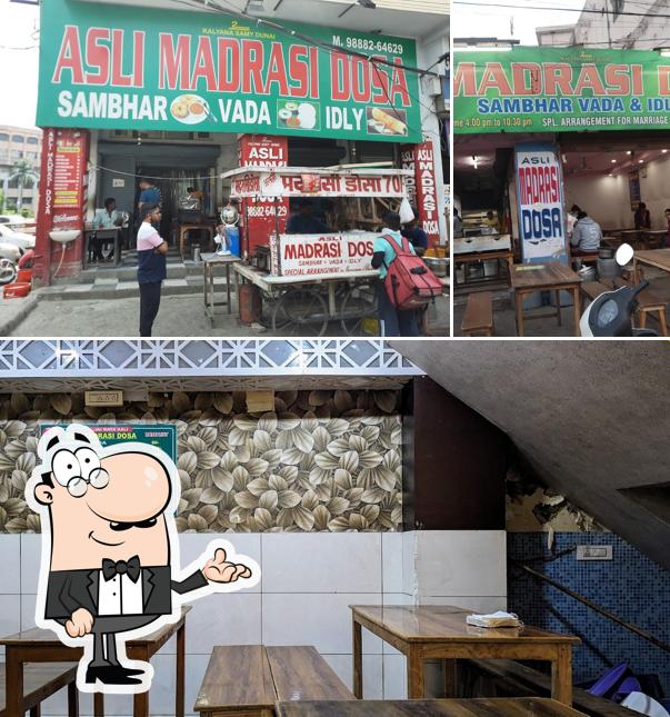 Take a seat at one of the tables at Asli Madrasi Dosa